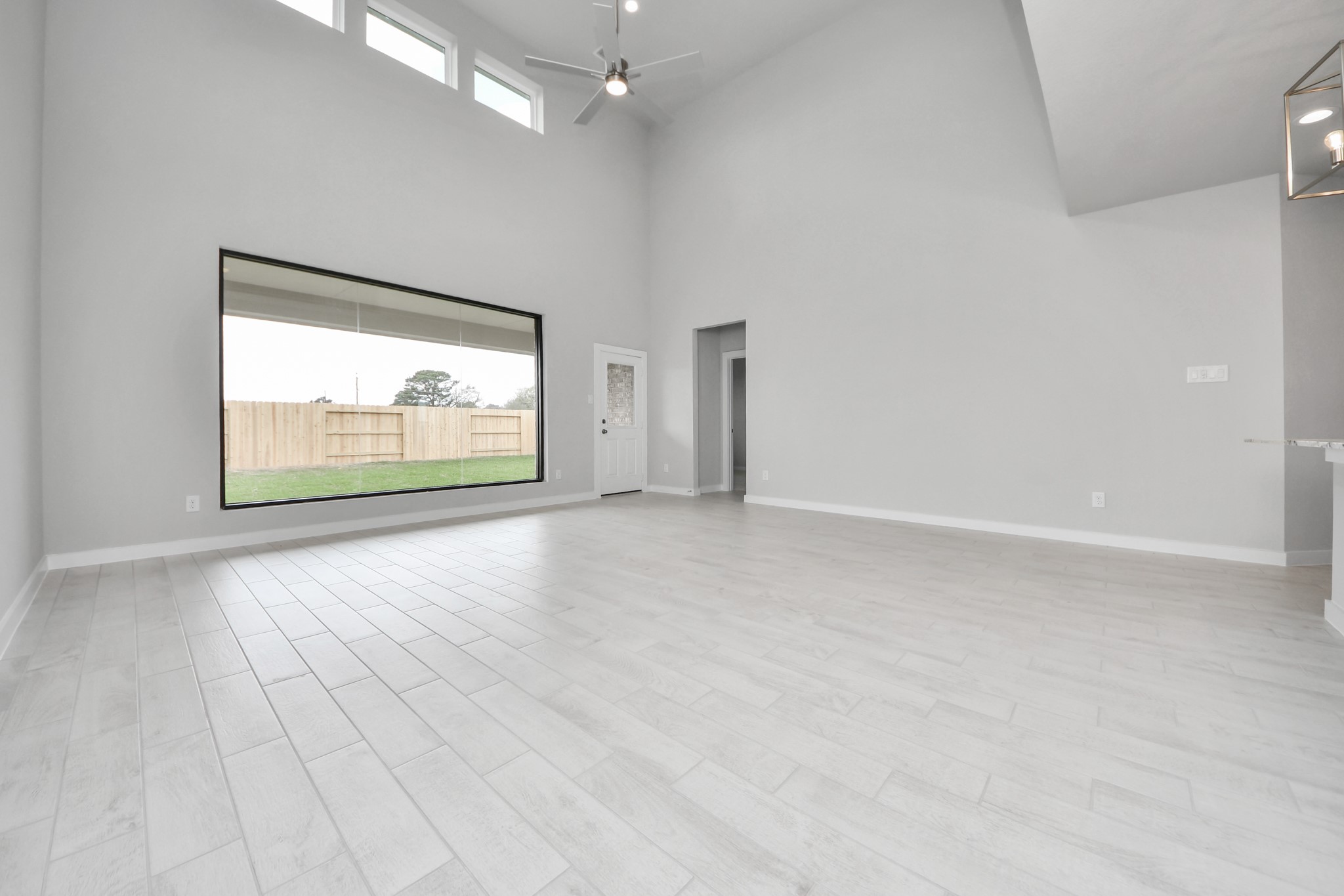 11122 Tulip Rdg Trail Houston, TX 77044 - Photo 17 of 34 wooden floor in an empty room with a window