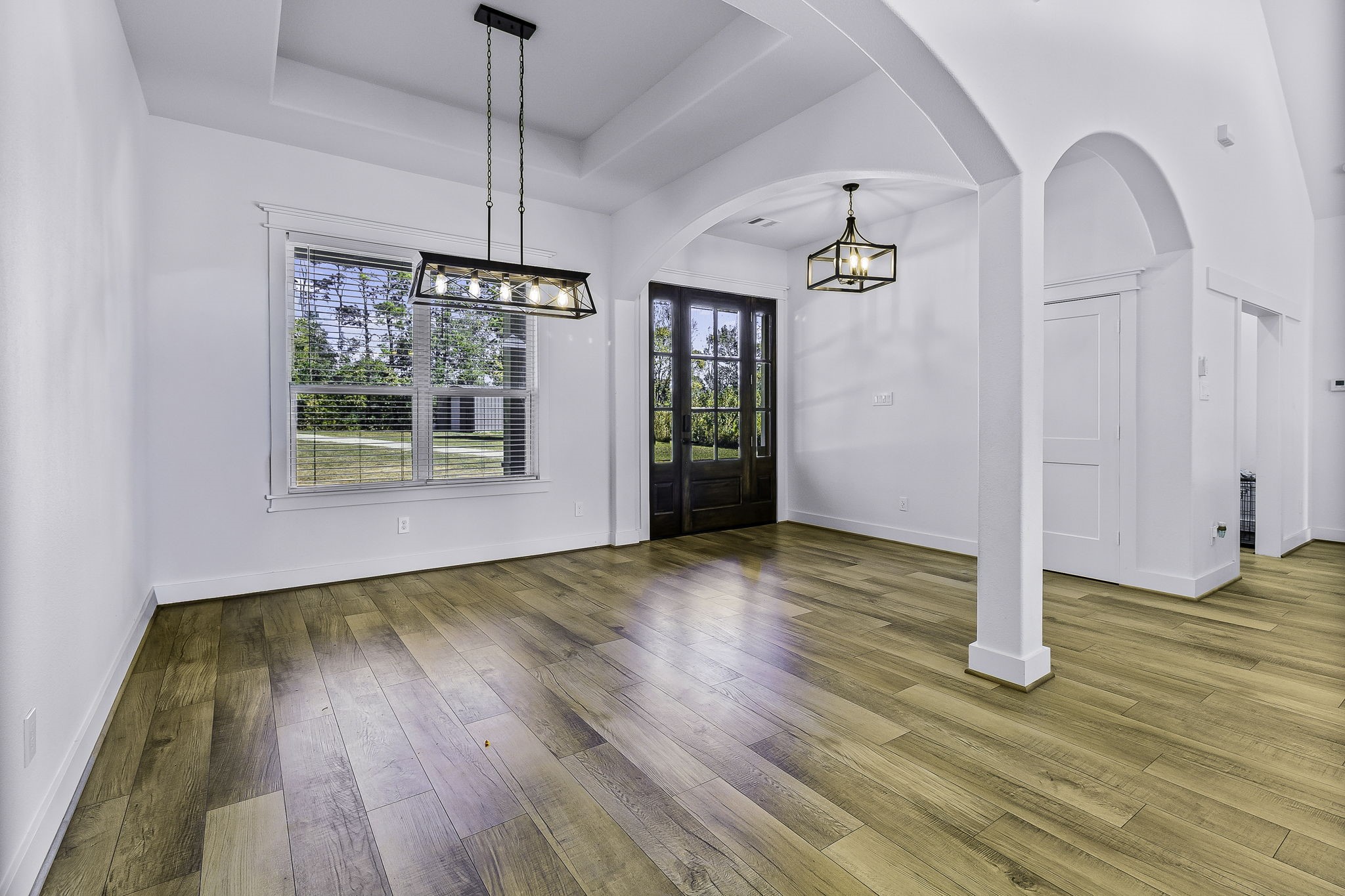 440 Farm To Market 223 Shepherd, TX 77371 - Photo 6 of 40 a view of empty room with wooden floor and fan