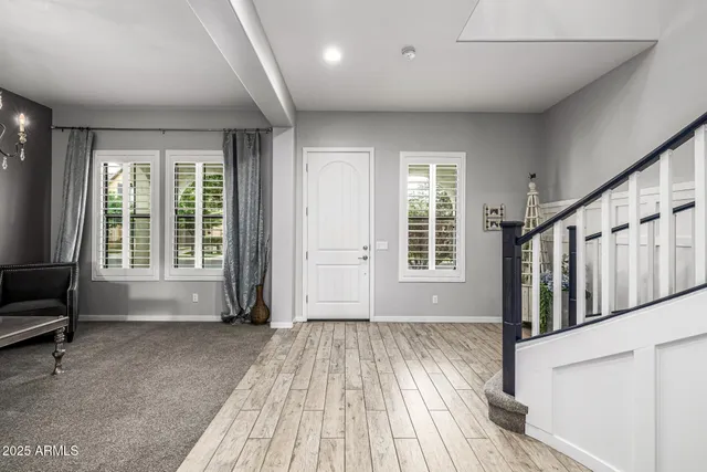 a kitchen with stainless steel appliances kitchen island granite countertop a stove a refrigerator and a wooden cabinets