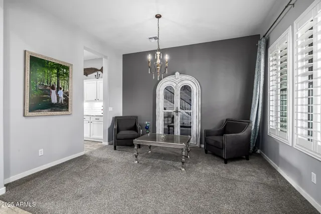 a kitchen with granite countertop a sink a stove and cabinets
