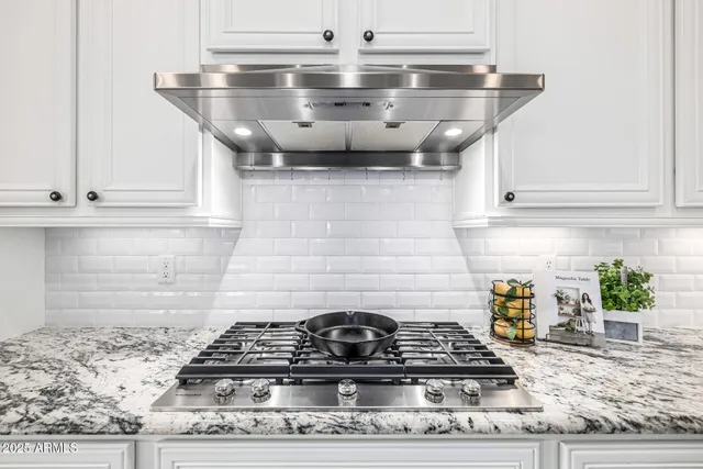 a bathroom with a sink mirror and toilet