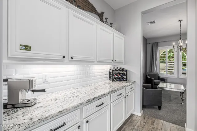 a bedroom with furniture and a flat screen tv