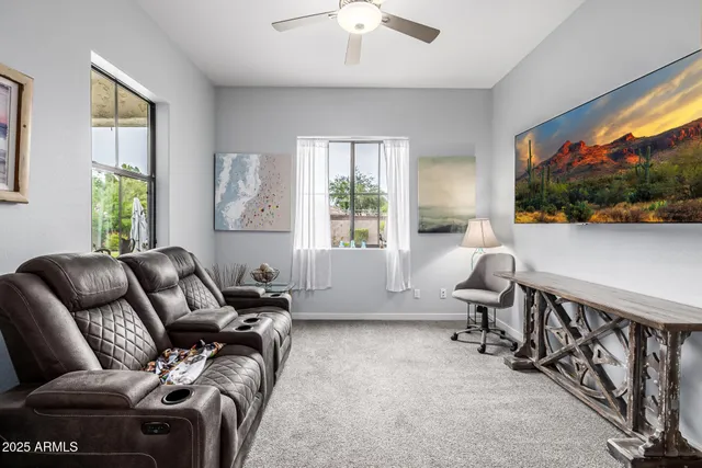 a bathroom with a sink a potted plant and a mirror