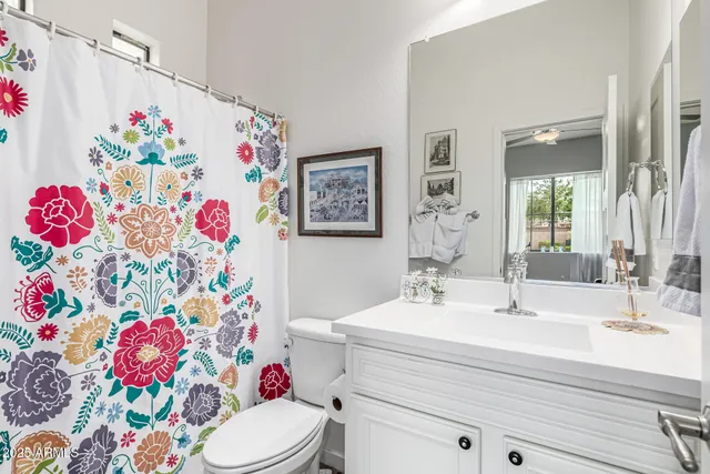 a bedroom with a bed and a desk