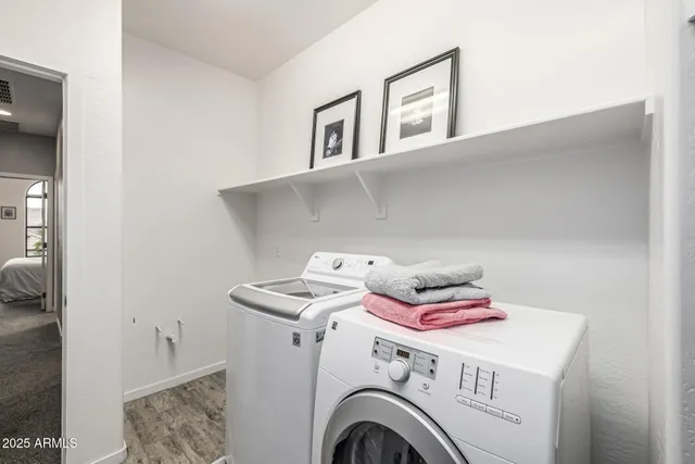 a view of a patio with table and chairs and potted plants
