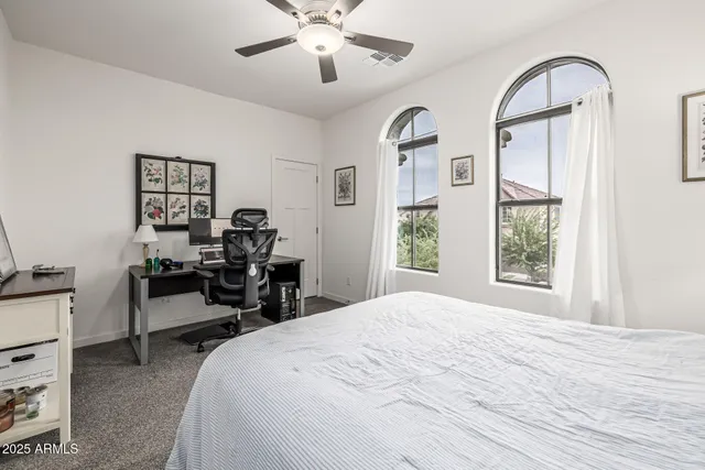 a very nice looking living room with furniture and a large window