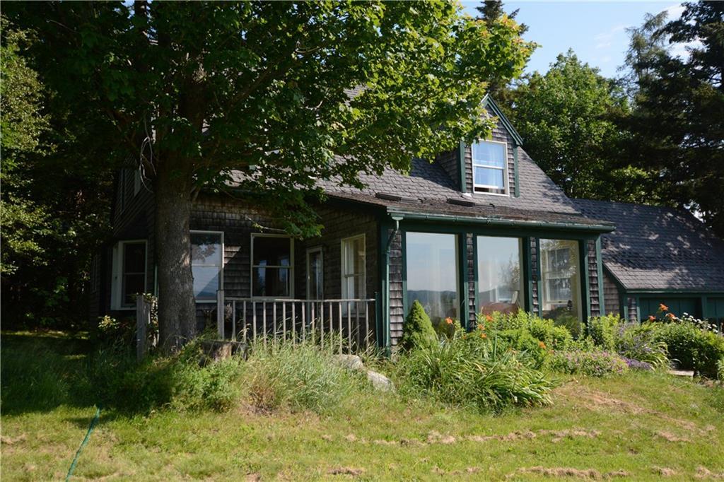 2336 Belfast Road Lincolnville, ME 04849 - Photo 7 of 23 The sunroom, with three big windows,...