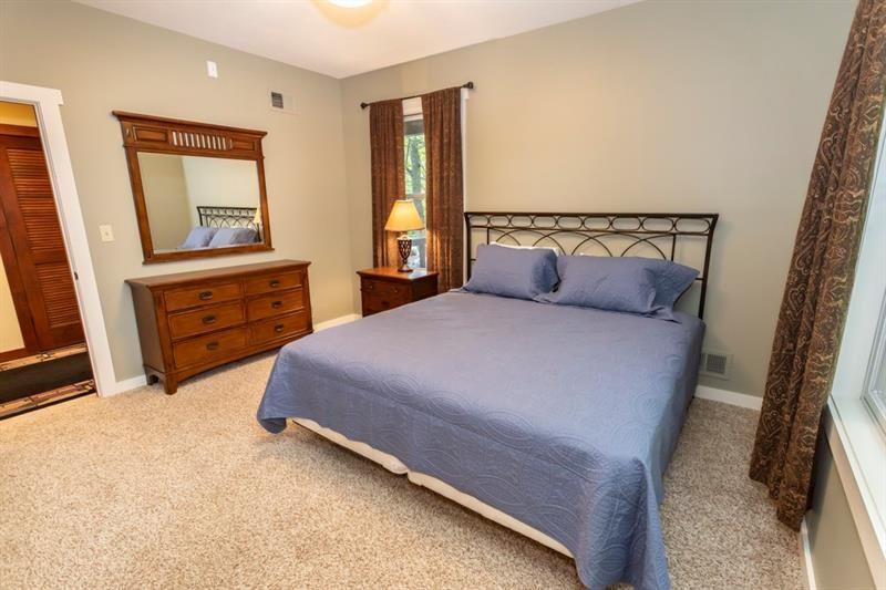 2226 County Line Road Champion, PA 15622 - Photo 15 of 33 a bedroom with a bed and wooden floor