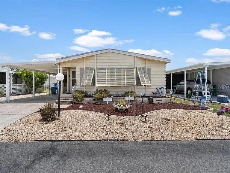 a view of a living room and bedroom