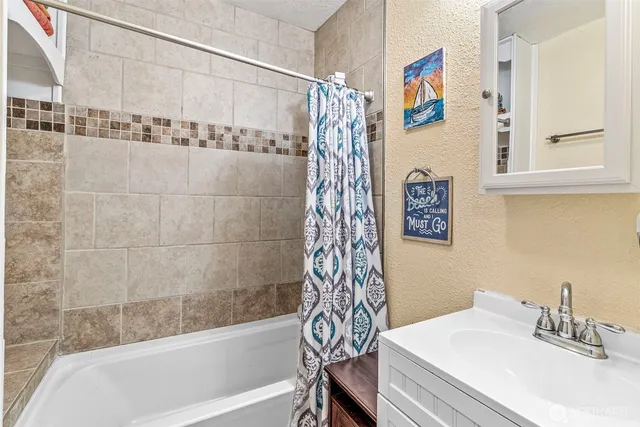 a bathroom with a sink and a bathtub