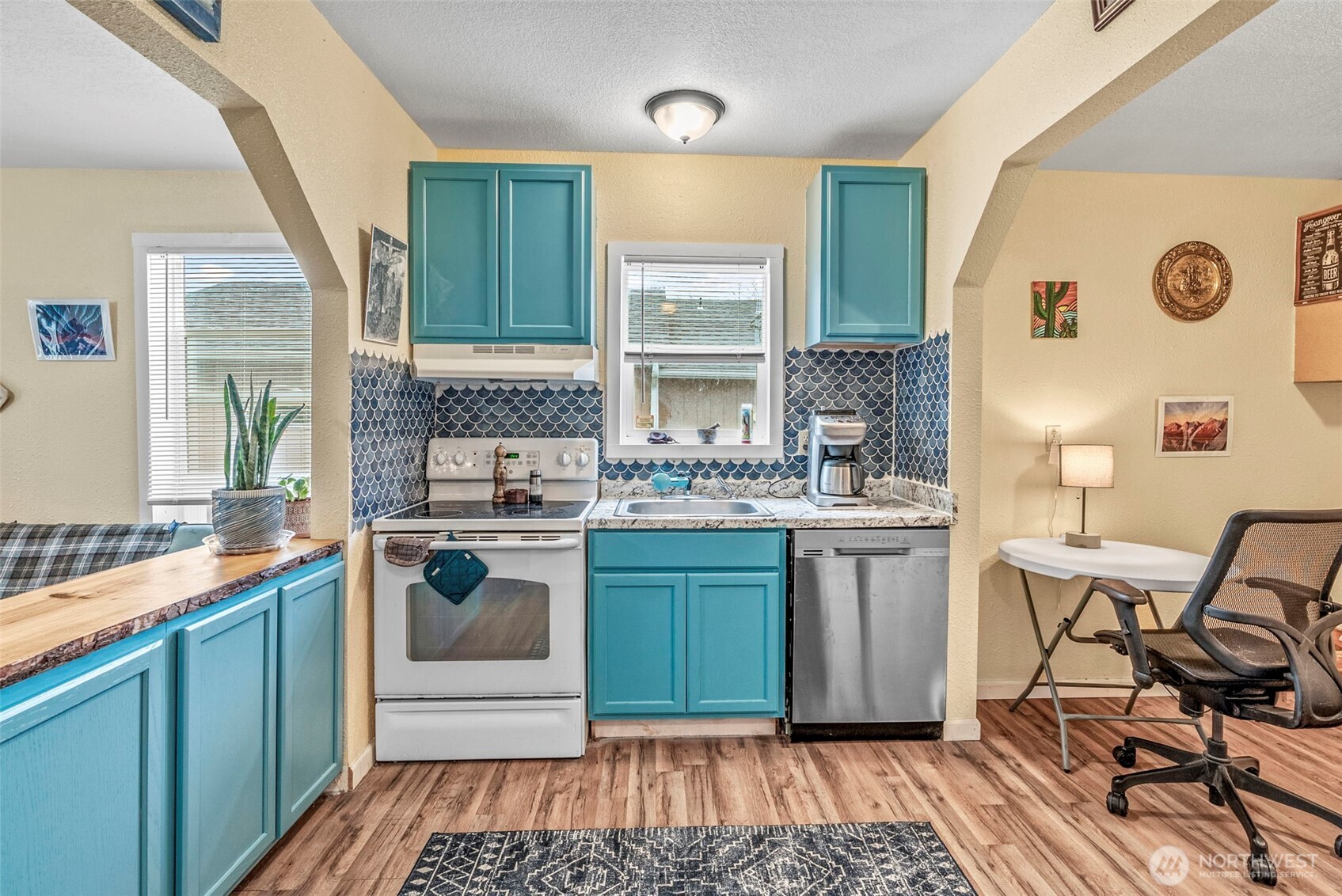 268 25th Avenue Longview, WA 98632 - Photo 7 of 15 a kitchen with a sink stove and cabinets