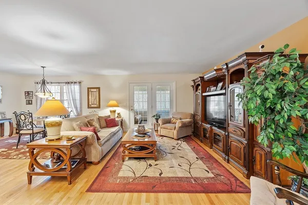 a bed room with furniture and a flat screen tv