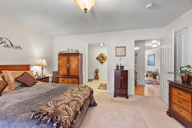 a bedroom with a bed and a couch