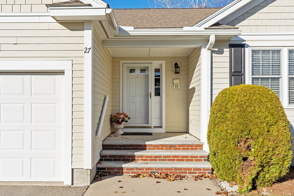 27 Russell Farm Drive, Unit 27 Methuen, MA 01844 - Photo 2 of 39 a front view of a house with a garden