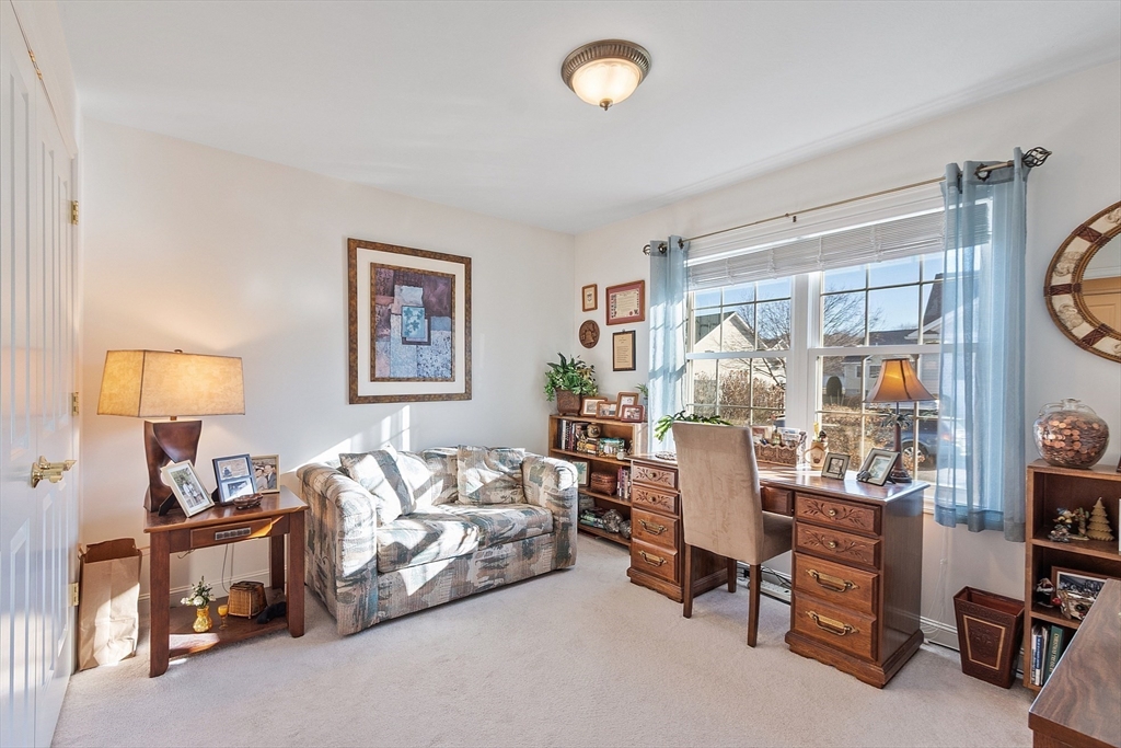 27 Russell Farm Drive, Unit 27 Methuen, MA 01844 - Photo 22 of 39 a living room with furniture and a window