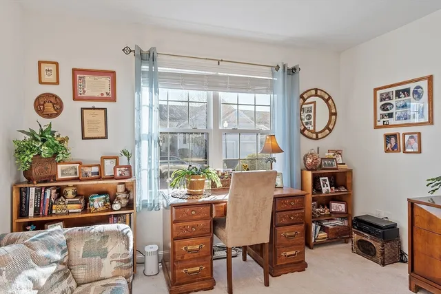 a workspace with furniture and window
