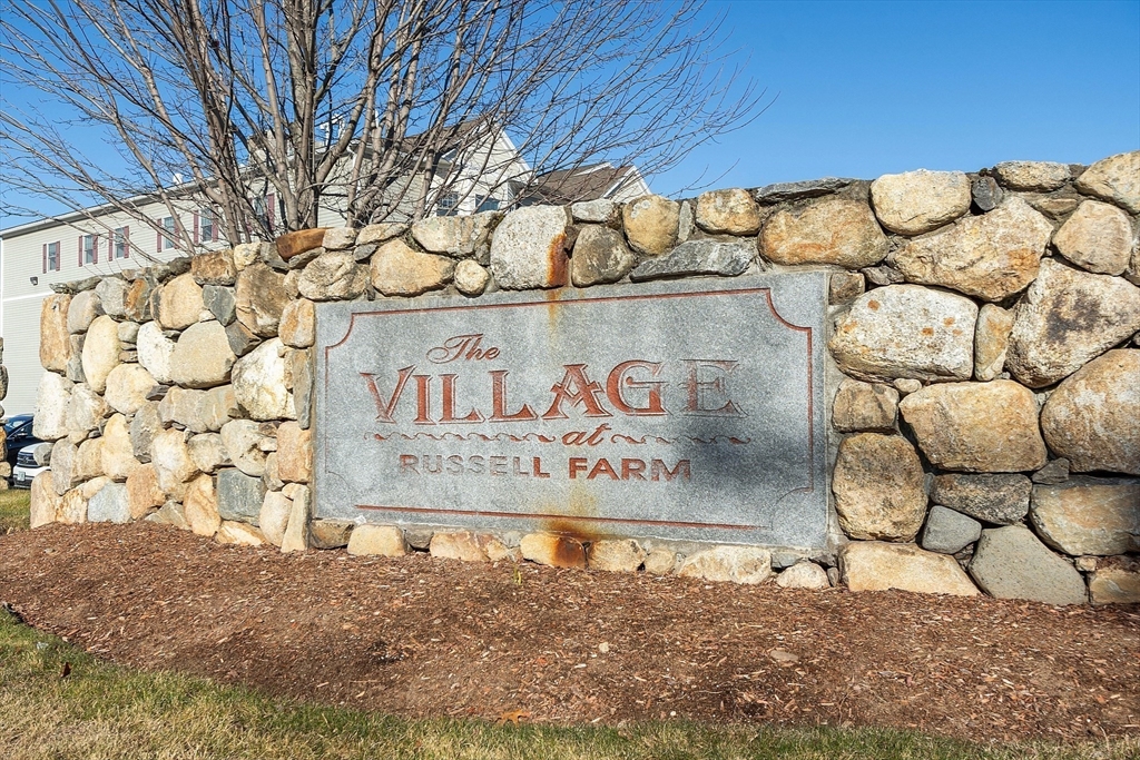 27 Russell Farm Drive, Unit 27 Methuen, MA 01844 - Photo 35 of 39 a sign broad on the wall