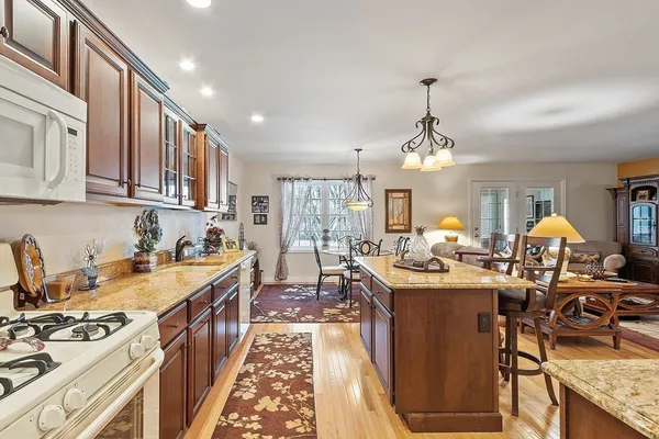 a kitchen with stove and cabinets