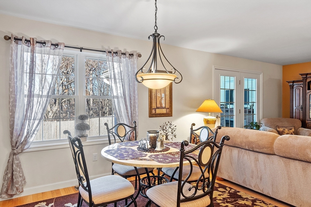 27 Russell Farm Drive, Unit 27 Methuen, MA 01844 - Photo 8 of 39 a view of a dining room with furniture window and wooden floor