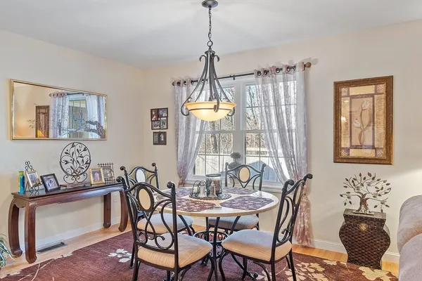 a view of a dining room with furniture window and outside view