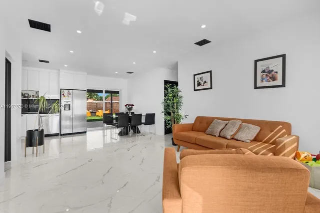 a living room with furniture and a table