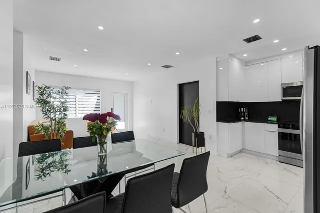 a room with furniture and potted plant