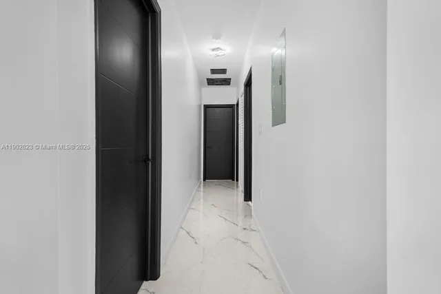 a view of a bathroom with a shower and a sink
