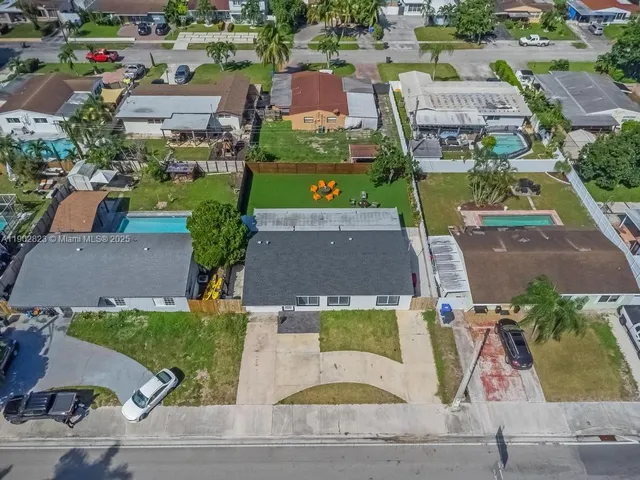 an aerial view of a house with a garden