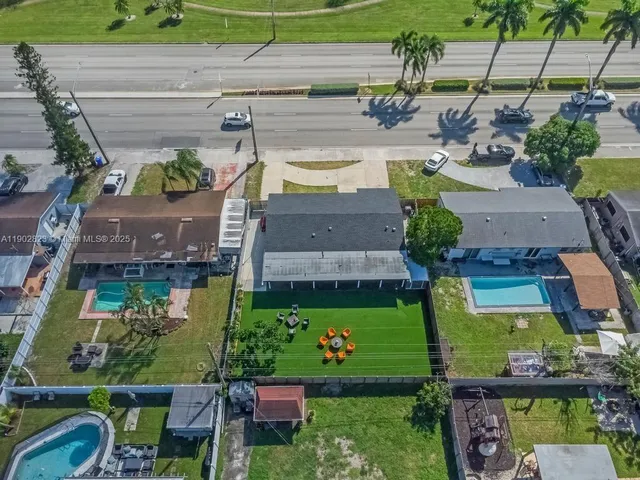 an aerial view of a house with a garden and plants