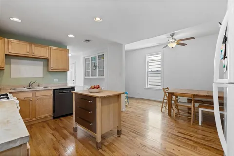 a kitchen with a stove a sink and a refrigerator
