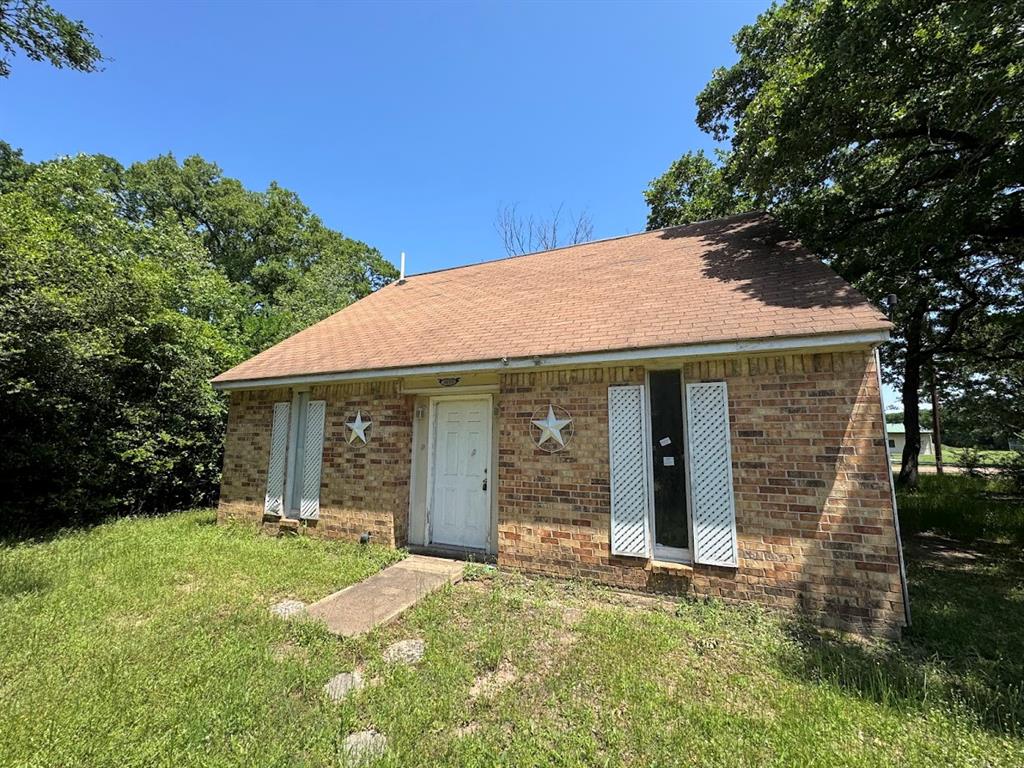 6133 Inca Drive Mabank, TX 75156 - Photo 1 of 10 front view of a house with a yard