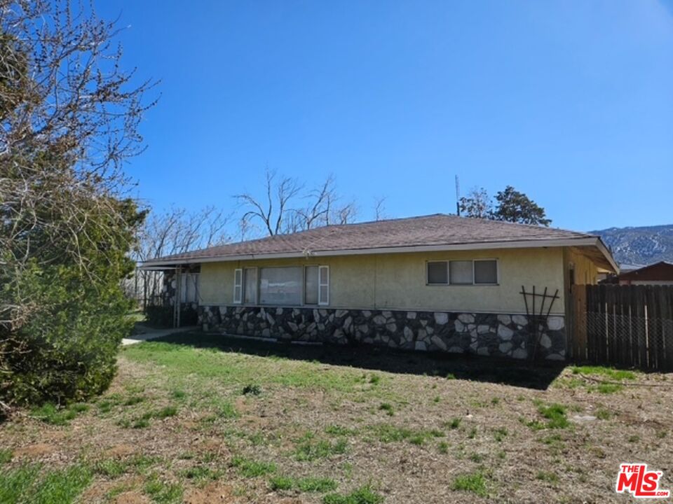 1300 West Valley Boulevard Tehachapi, CA 93561 - Photo 6 of 14 a view of a house with wooden fence