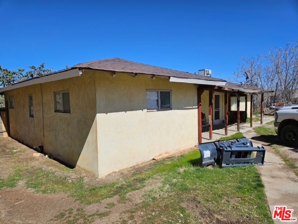 1300 West Valley Boulevard Tehachapi, CA 93561 - Photo 9 of 14 a view of a house with backyard and sitting area