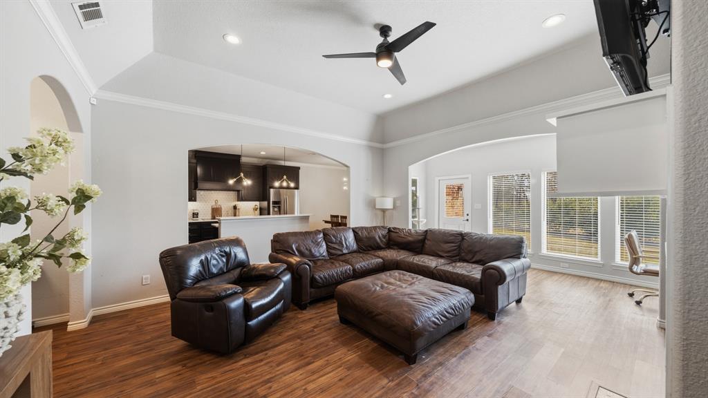 101 Lighthouse Lane Mabank, TX 75143 - Photo 5 of 40 Living area with ceiling fan, wood finished floors, recessed lighting, and ornamental molding