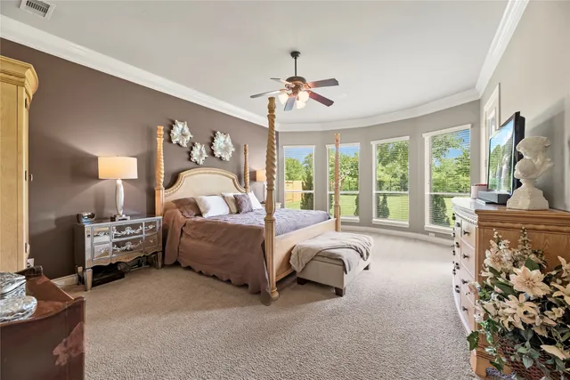 a view of a livingroom with furniture and floor to ceiling window