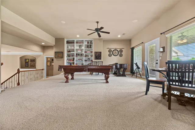 a large bedroom with a large bed and furniture