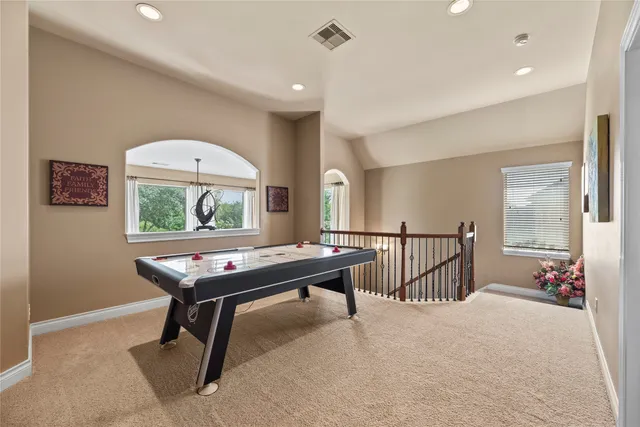 a view of a livingroom with furniture and a window