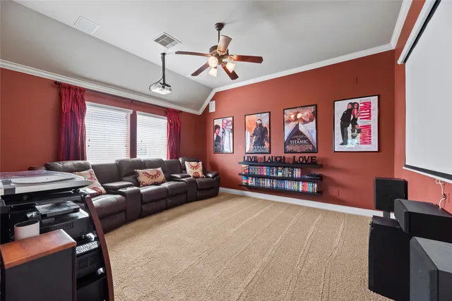 a living room with furniture gym equipment and a large window
