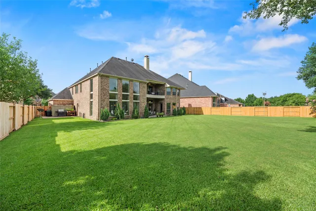 a view of a house with a big yard