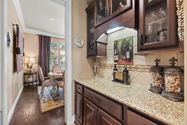 a kitchen with sink and cabinets