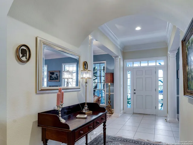 a kitchen with stainless steel appliances kitchen island granite countertop a table and chairs in it