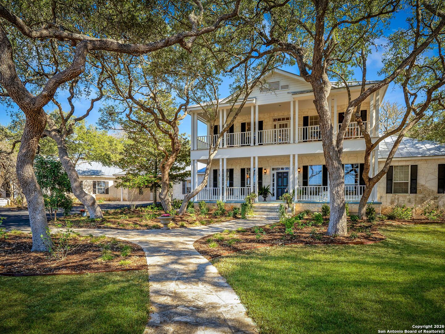 155 Cibolo Ridge Trail Boerne, TX 78015 - Photo 2 of 100 a front view of a building with a garden