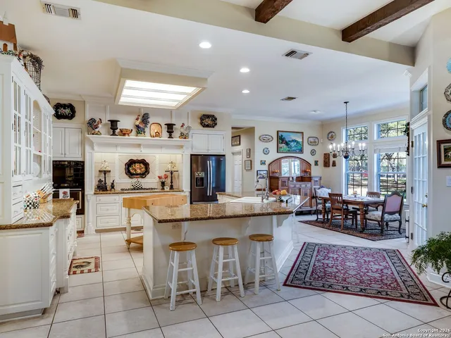 a bedroom with a bed a couch and a window