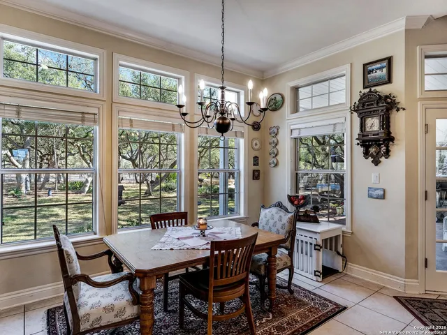 a en suite bathroom with a double vanity sink and a mirror