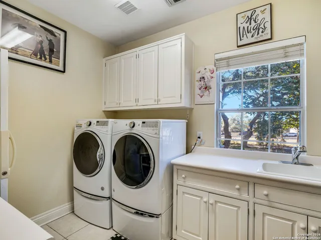 a bedroom with a bed and a flat screen television