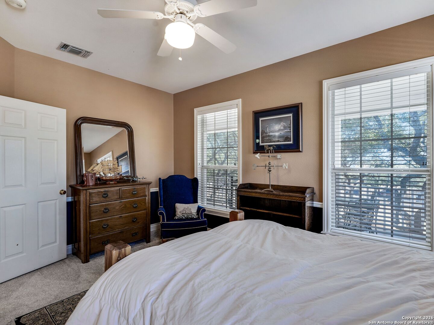 155 Cibolo Ridge Trail Boerne, TX 78015 - Photo 50 of 100 a bedroom with a bed and a chandelier