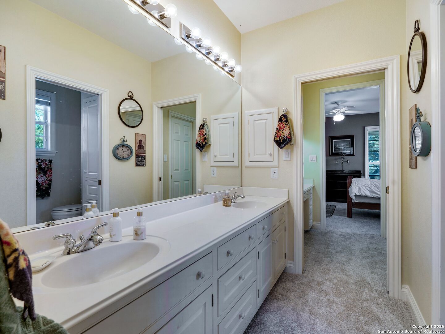 155 Cibolo Ridge Trail Boerne, TX 78015 - Photo 53 of 100 a en suite bathroom with a double vanity sink and a mirror