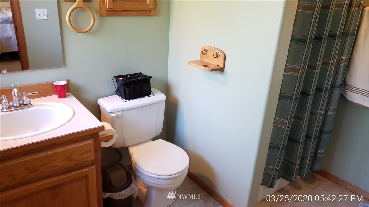 3956 Magrath Road Bellingham, WA 98226 - Photo 8 of 13 a white toilet sitting next to a bathroom sink