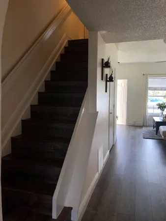 a view of staircase and door