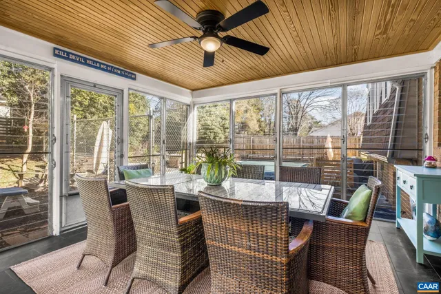 a view of a hallway with wooden floor and closet area